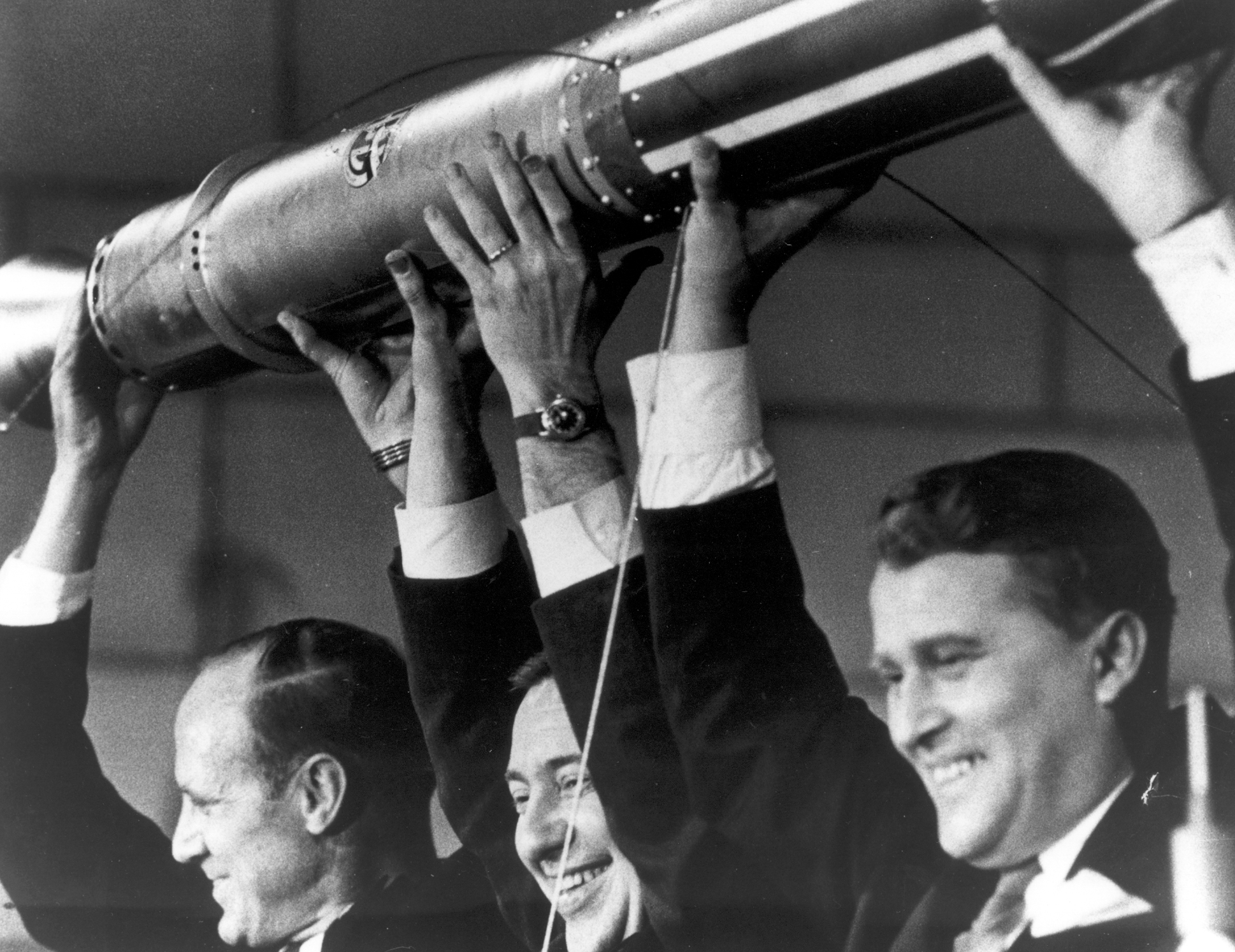 Photo of P. Van Allen and W. Von Braun holding satellite
